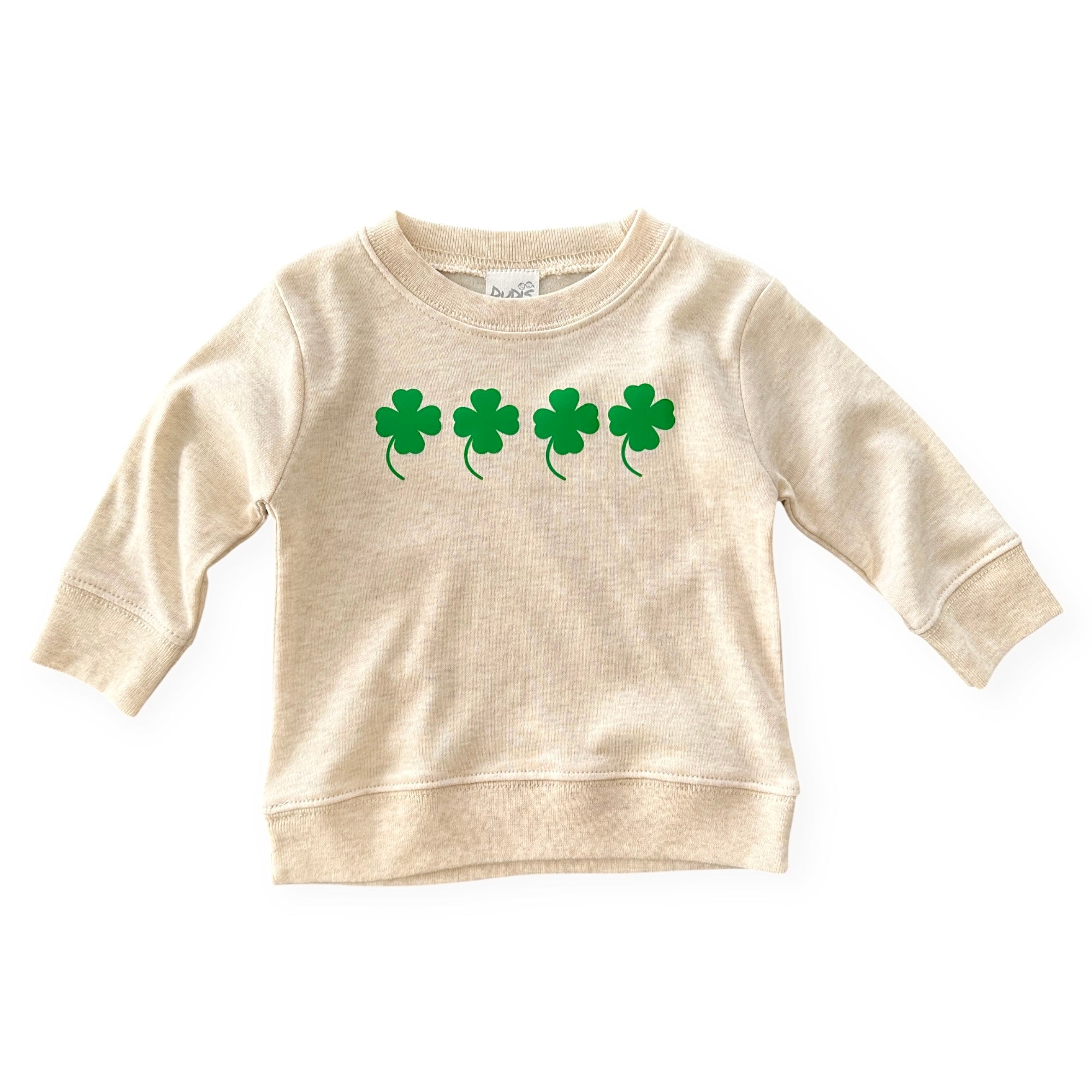 Neutral cream baby and toddler pullover with four green shamrocks printed across the chest. A cozy and stylish St. Patrick’s Day sweatshirt, perfect for boys and girls. Soft, comfortable, and great for festive celebrations or everyday wear. Available in sizes newborn to 4T.