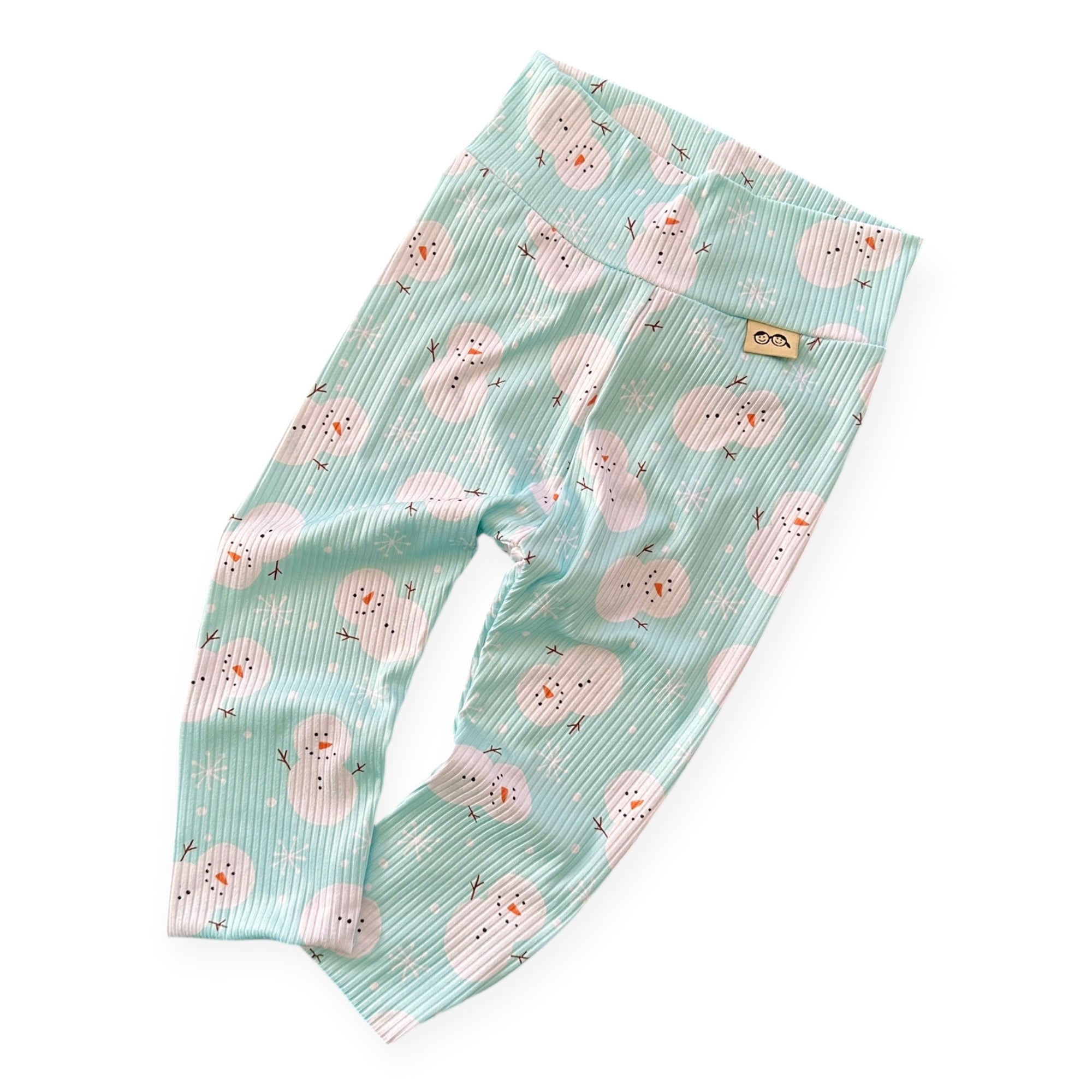 Soft ribbed mint snowman Christmas leggings for babies and toddlers – handmade winter outfit.