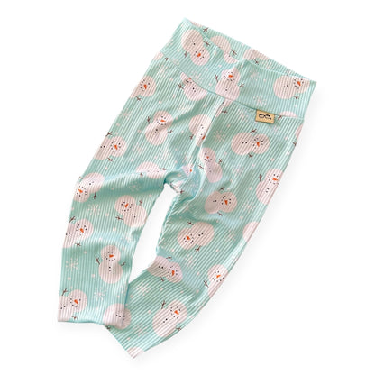 Soft ribbed mint snowman Christmas leggings for babies and toddlers – handmade winter outfit.