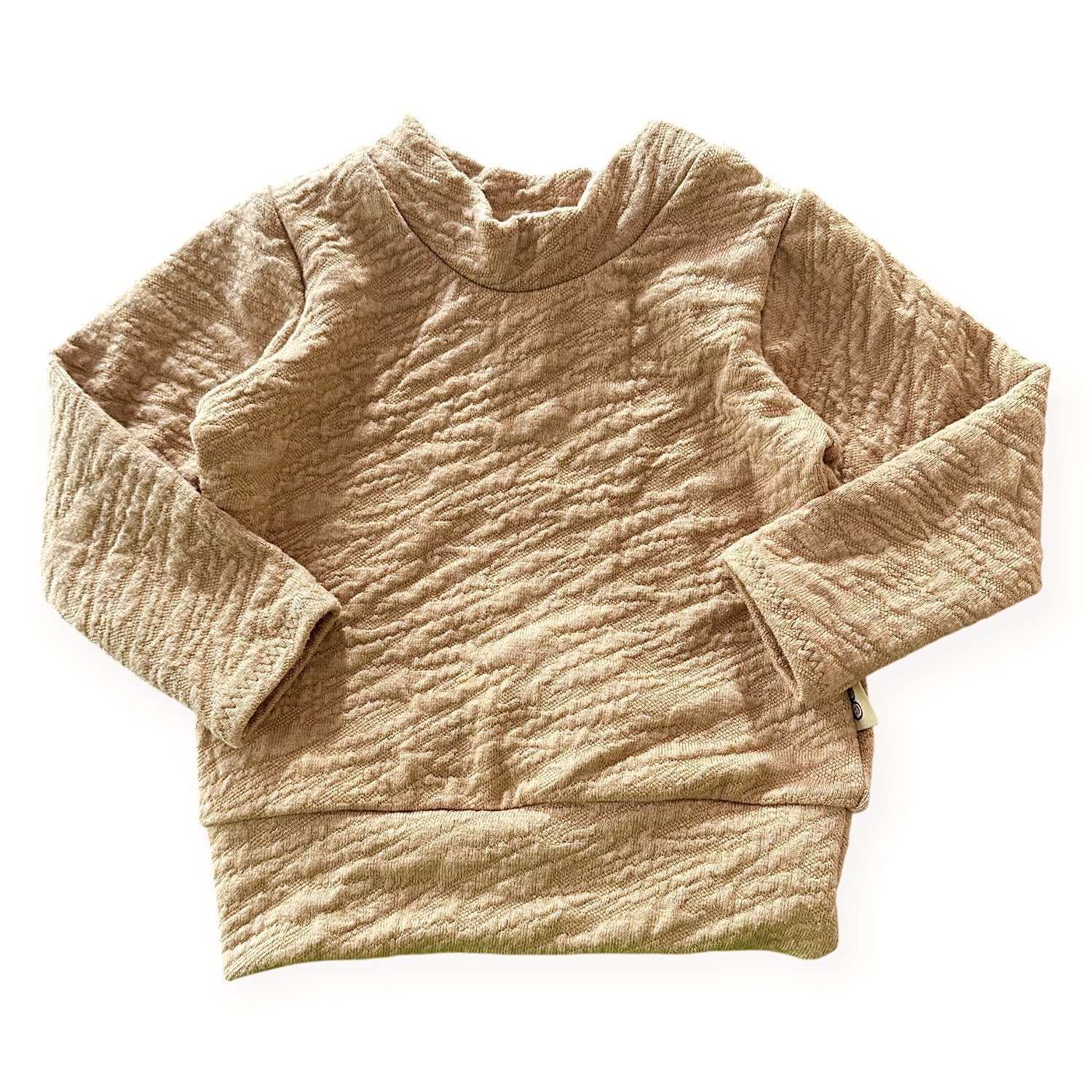 Beige textured sweater on a white background