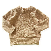 Beige textured sweater on a white background