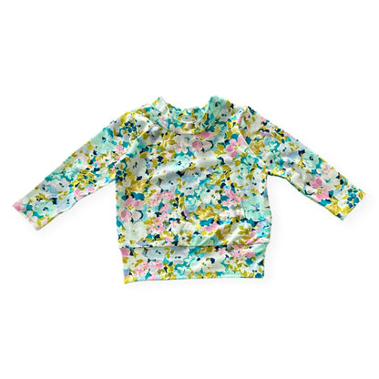 Floral patterned long-sleeve shirt on a white background