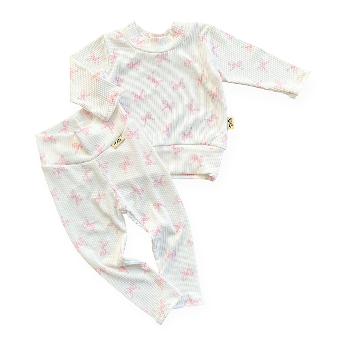 Baby outfit with long-sleeve top and pants on a white background