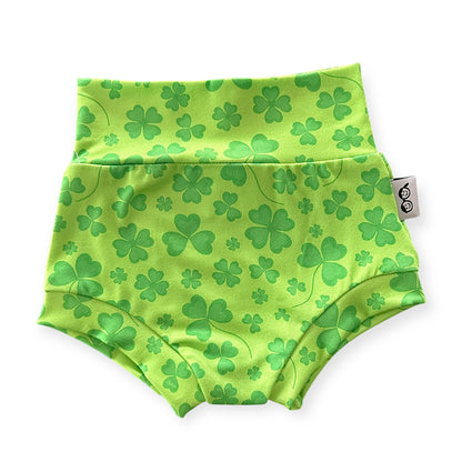 Green shamrock baby bummies with a high-waisted design, perfect for St. Patrick’s Day celebrations. These soft and stretchy diaper covers are ideal for newborns, infants, and toddlers, offering comfort and style for festive outfits or everyday wear.