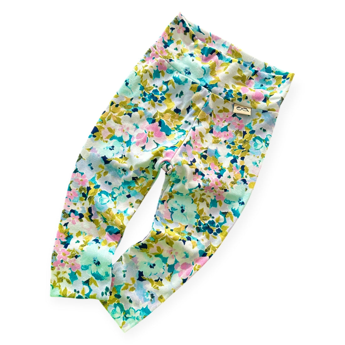 Floral patterned baby leggings on a white background
