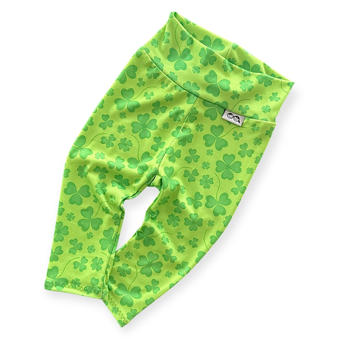 Bright green shamrock leggings for babies and toddlers, perfect for St. Patrick&