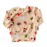 Retro-style Christmas ribbed baby top with Santa, reindeer, and wreath print – handmade holiday outfit.