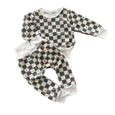 Flat lay of charcoal checker icon lounge set with top and pants.