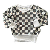 Charcoal checker baby sweatshirt with doodle and smiley icons, ribbed white cuffs.