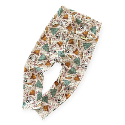 Cozy rib knit baby leggings with outdoor s’mores and camper print.