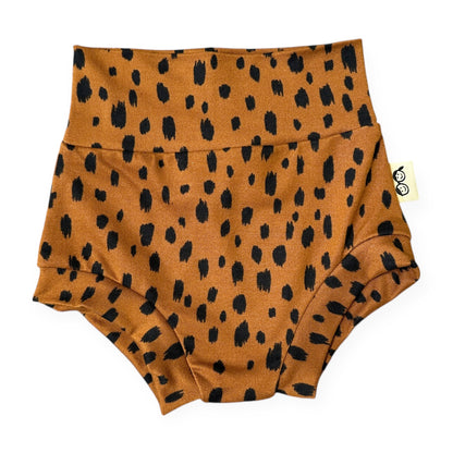 Brown diaper cover with black spotted pattern on a white background