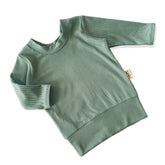 Sea Spray Ribbed Lounge Top in a soft green hue, featuring long sleeves and a cozy, stretchy fit perfect for babies and toddlers.