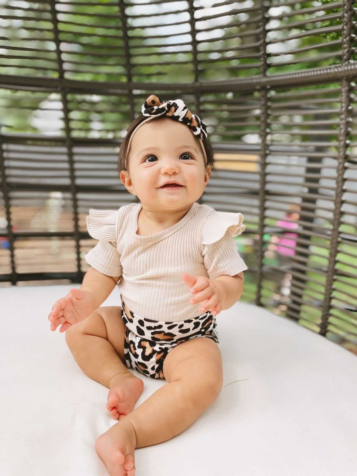 Baby Girl in Ivory Leopard Bummies 