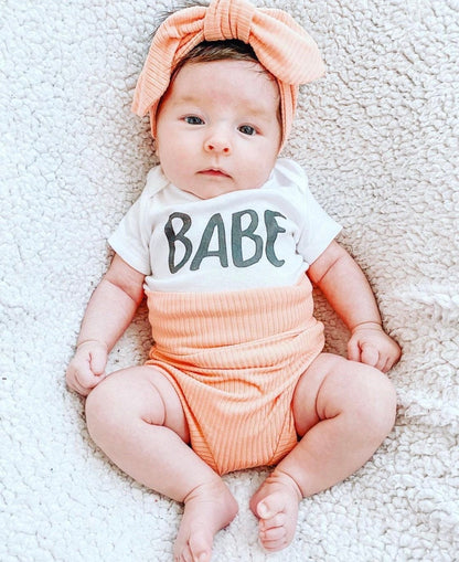 Baby Girl in Melon Ribbed Bummies 