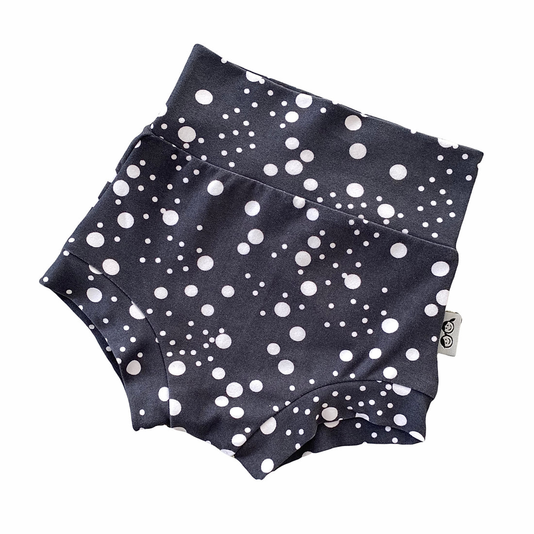 Handmade polka dot bummies for babies and toddlers, featuring a stylish black and white design. Soft, comfortable, and perfect as a diaper cover or for everyday wear. Ideal for active little ones and special occasions alike.