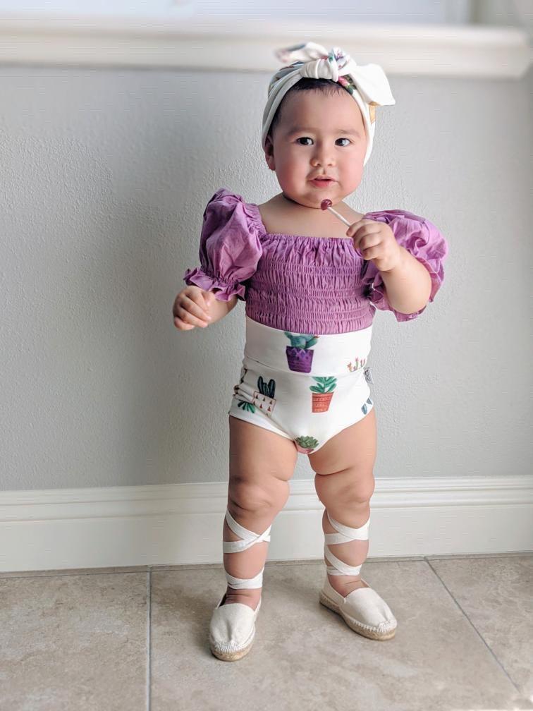 Adorable baby girl bummies with watercolor cactus pot print, great for summer wear.