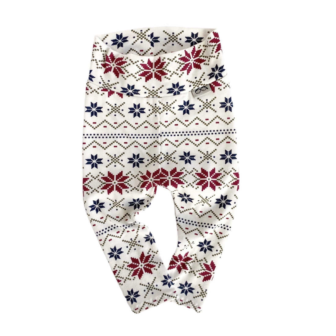 Handmade baby leggings with festive Nordic snowflake pattern in red, navy, and cream. Perfect for cozy winter outfits and holiday photos.