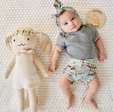 Baby Girl Wearing Dried Floral on Sage Ribbed Bummies 